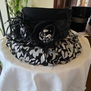 Champagne Italy black and white floral hat, with flower brooches and feathers
